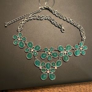 Beautiful teal chunky necklace with silver chain and small fake diamonds.